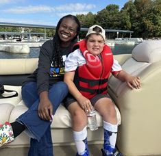 family on boat with Lekotek and Freedom Waters